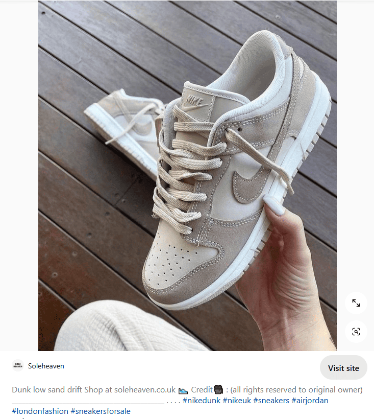 Nike Dunk Low Sand Drift sneakers in a user's hand with a product description on Pinterest